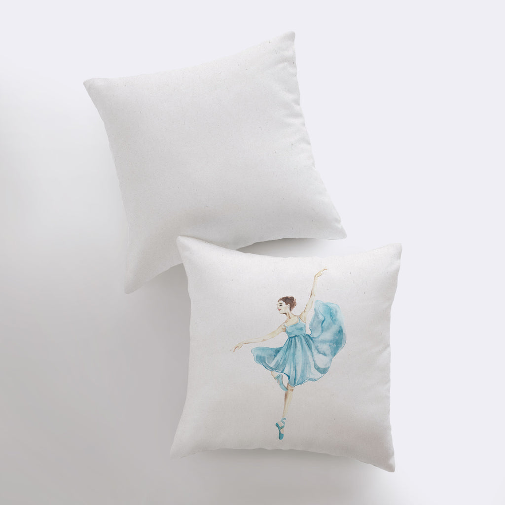 a white pillow with a ballerina on it