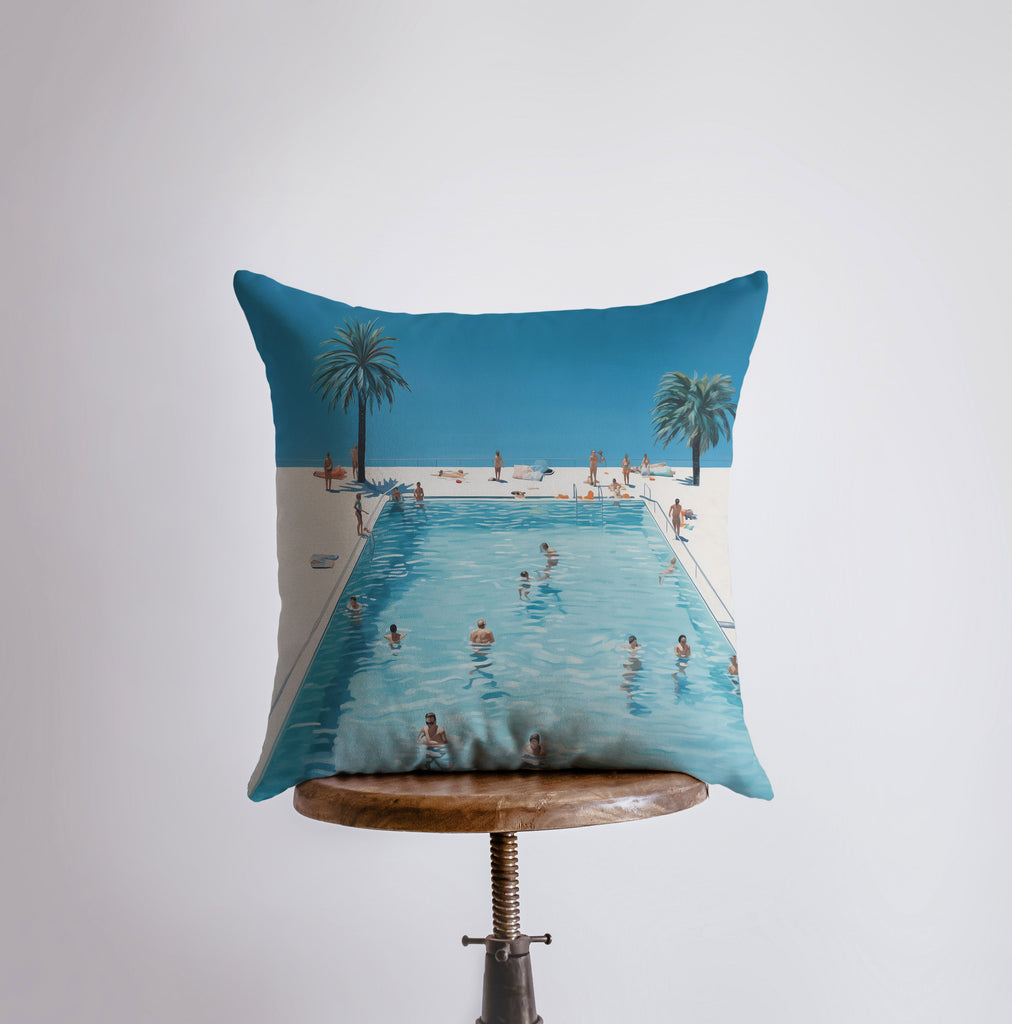 a pillow with a picture of people swimming in a pool