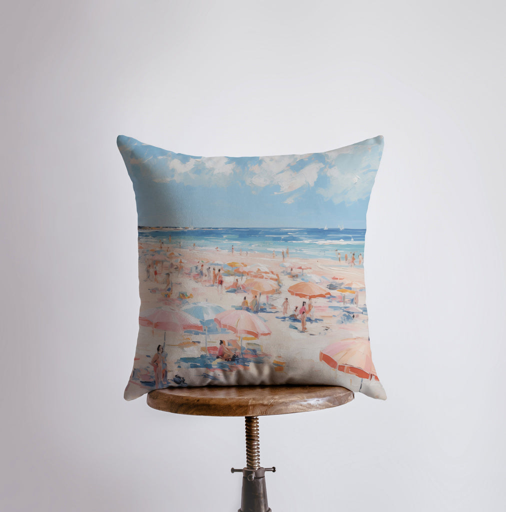 a pillow with a painting of a beach scene