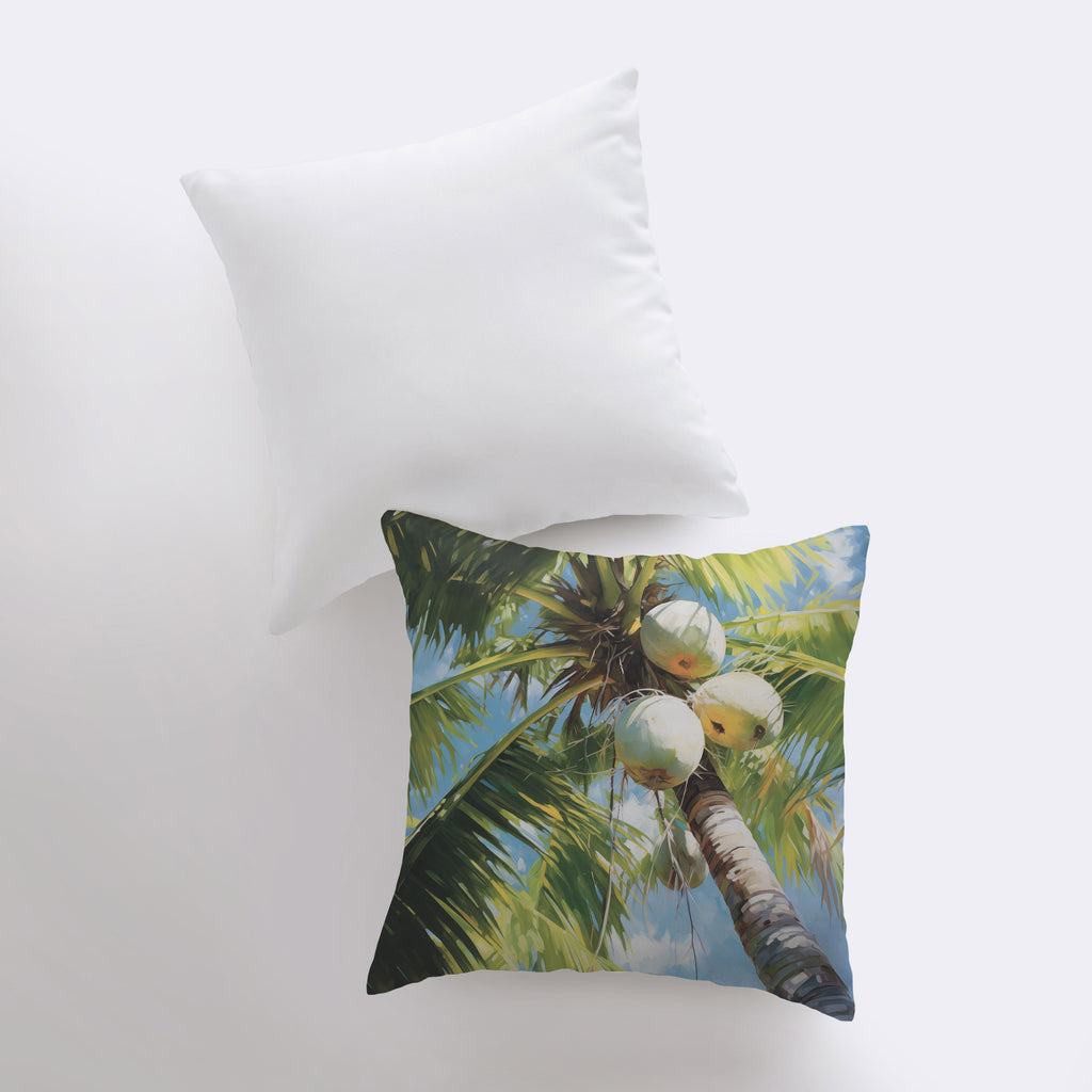 a pillow that has a picture of a coconut tree on it