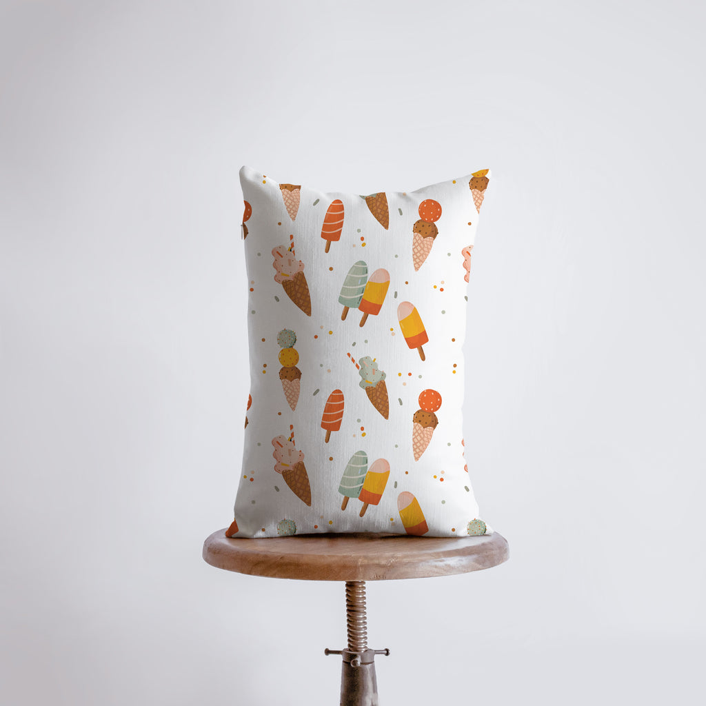 a white pillow with an ice cream pattern on it