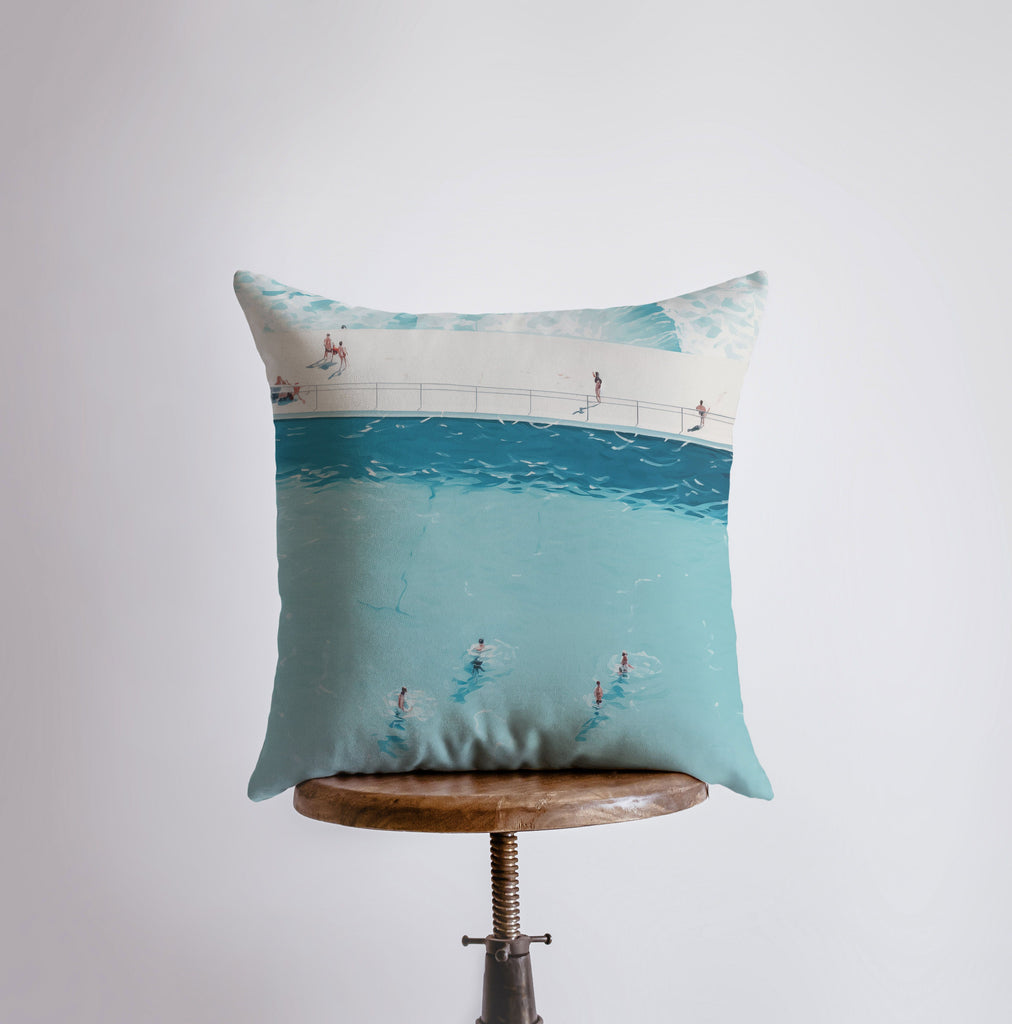 a pillow that has a picture of people in the water on it