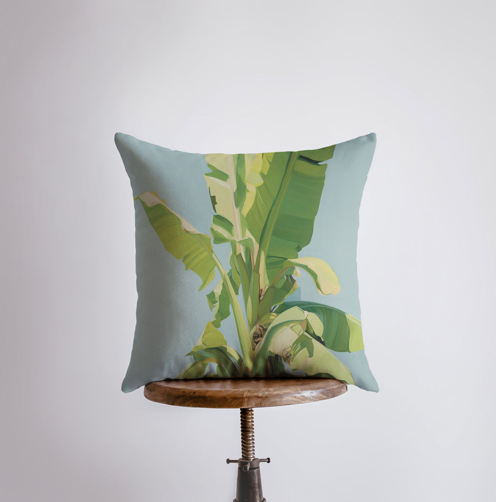 a pillow with a picture of a banana plant on it