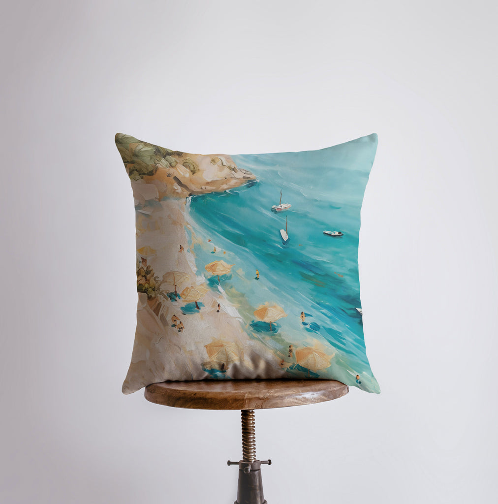 a pillow with a painting of a beach