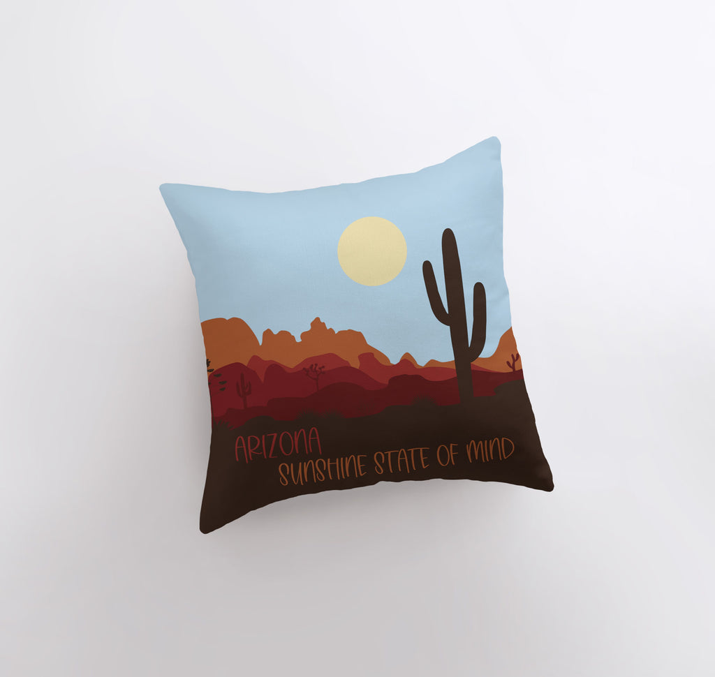 a pillow with a desert scene on it