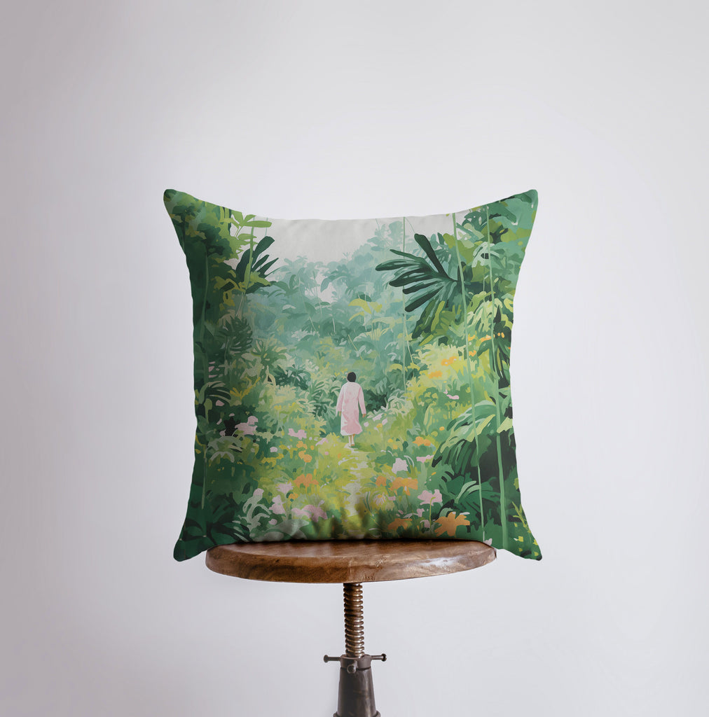 a pillow with a painting of a woman walking through a jungle