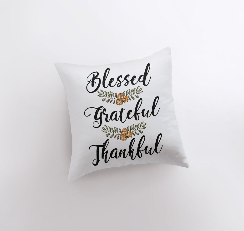 a white pillow with a black lettering that says,'blessed grateful, thank '