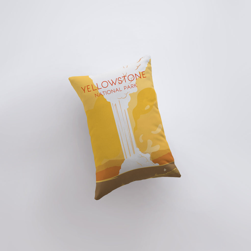 a yellow pillow sitting on top of a white wall