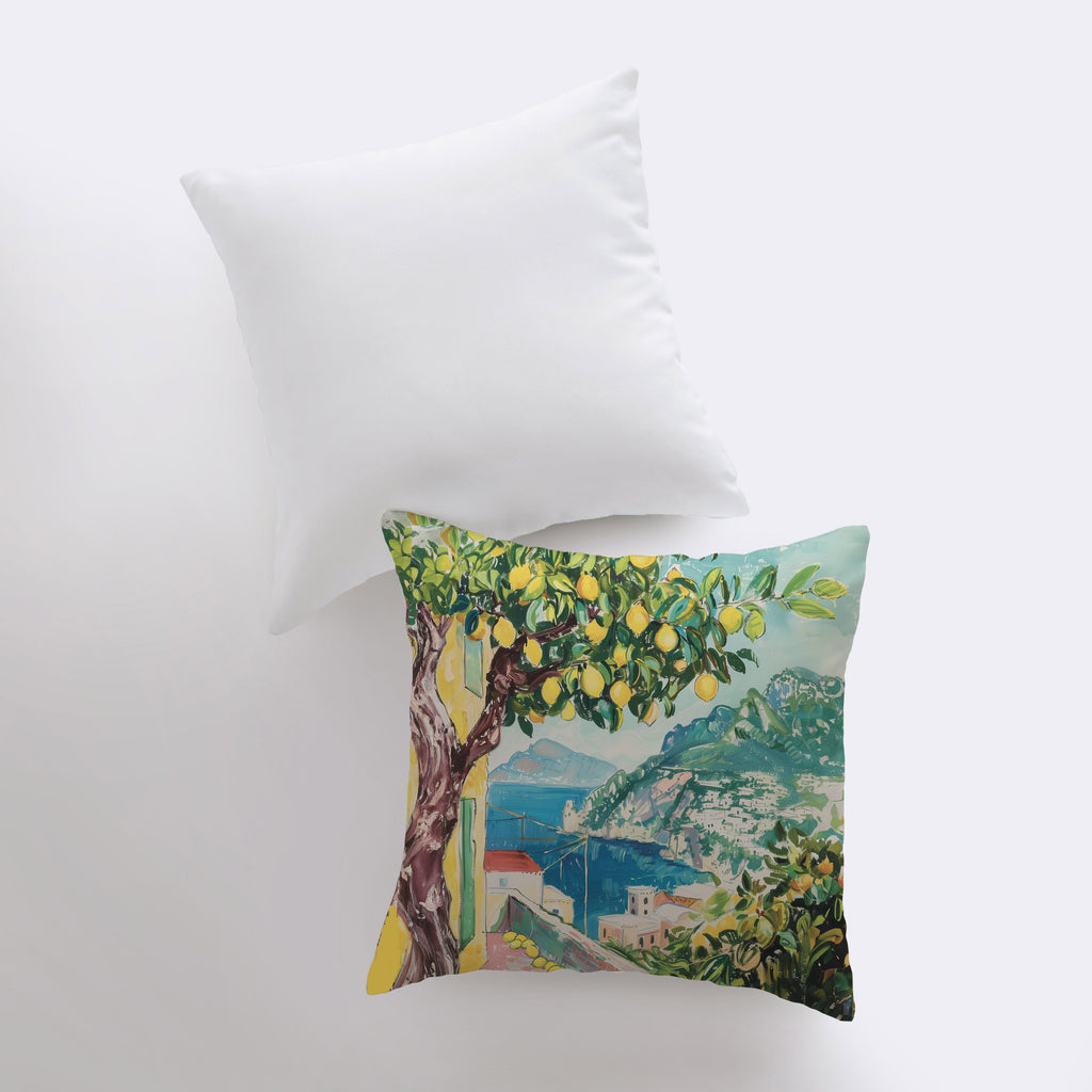 a pillow with a painting of a lemon tree