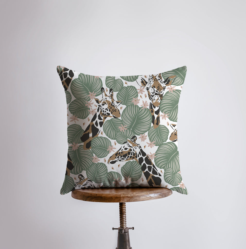 a giraffe print pillow sitting on top of a wooden stool