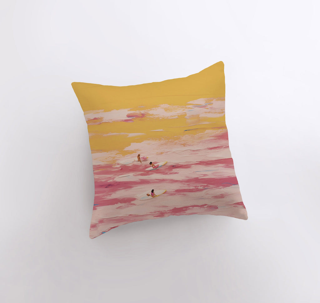 a yellow and pink pillow with birds flying in the sky