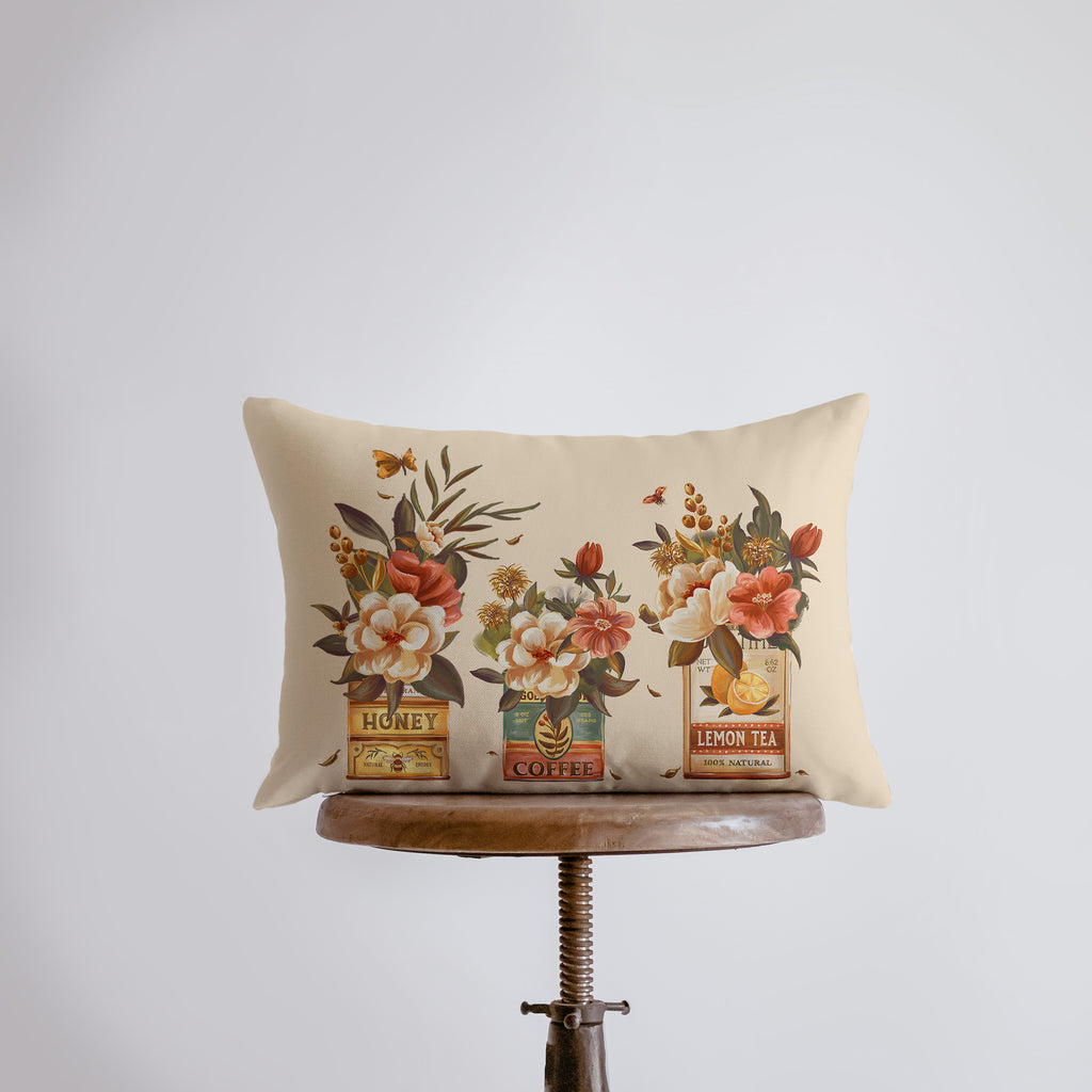 a pillow with flowers on it sitting on a table