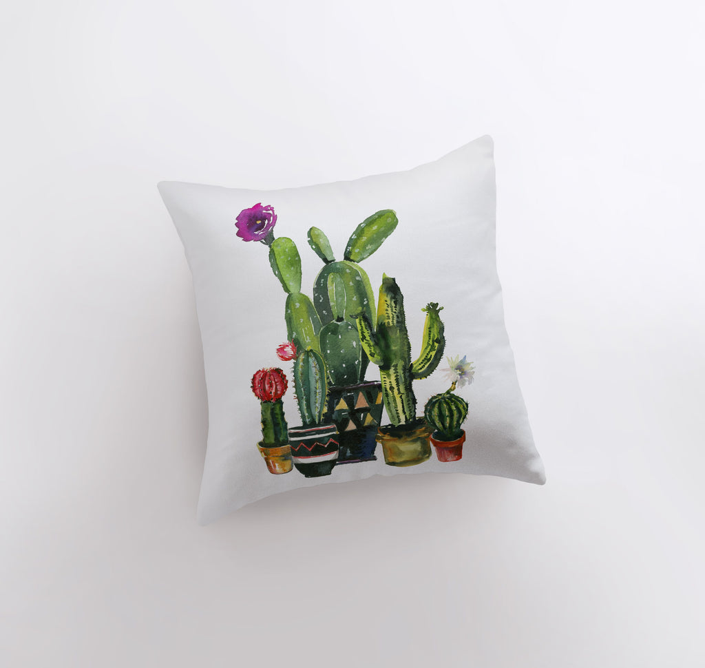 a pillow with a cactus and flowers on it