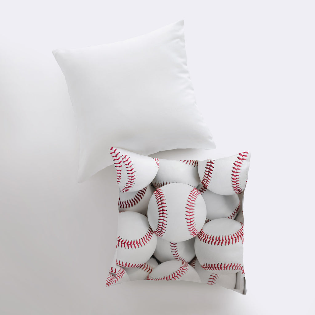 a pile of baseballs sitting on top of a pillow