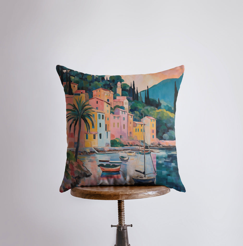 a pillow with a painting of boats in a harbor