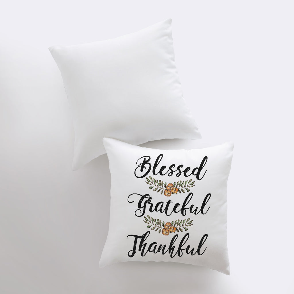 two white pillows with the words, blessed and grateful on them