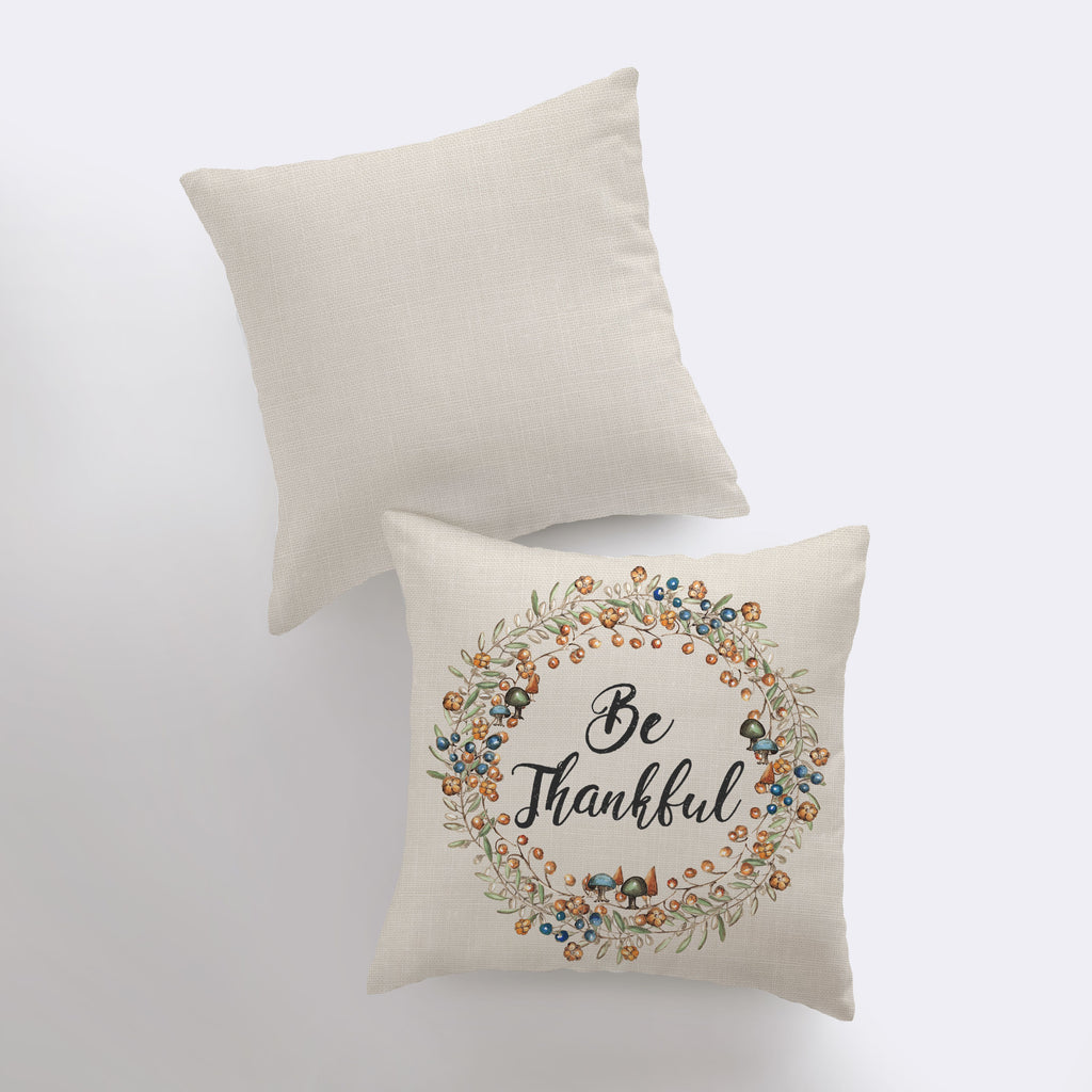 two pillows with the words be grateful on them