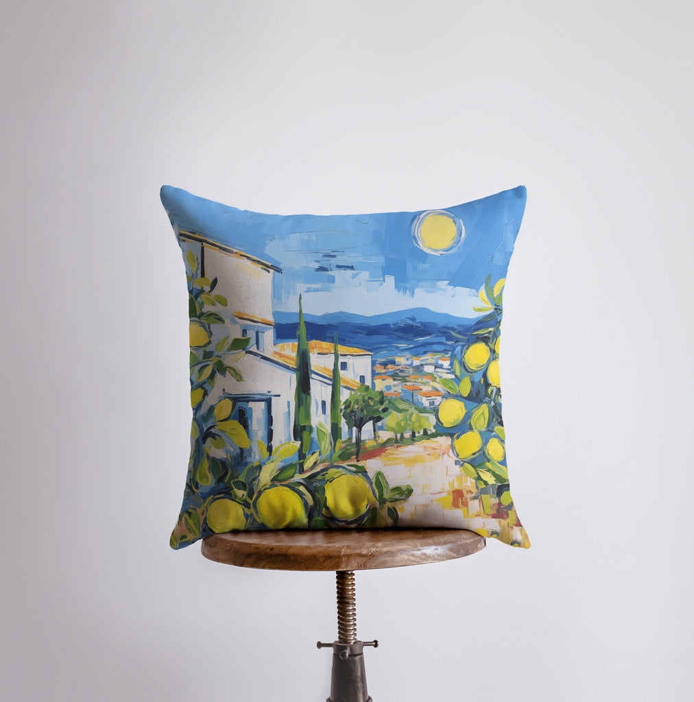 a pillow with a painting of lemons on it