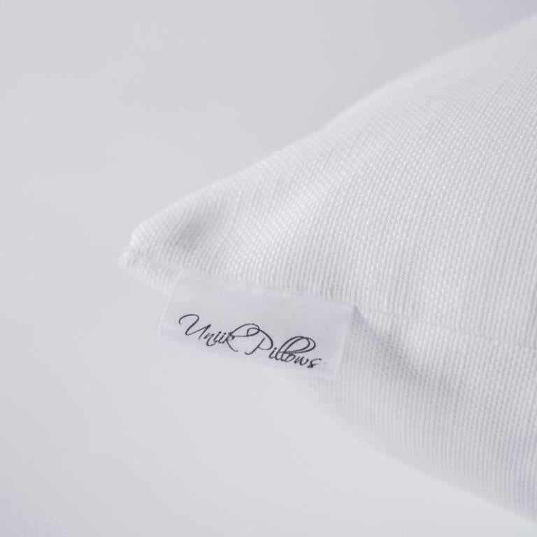 a white pillow with a label on it