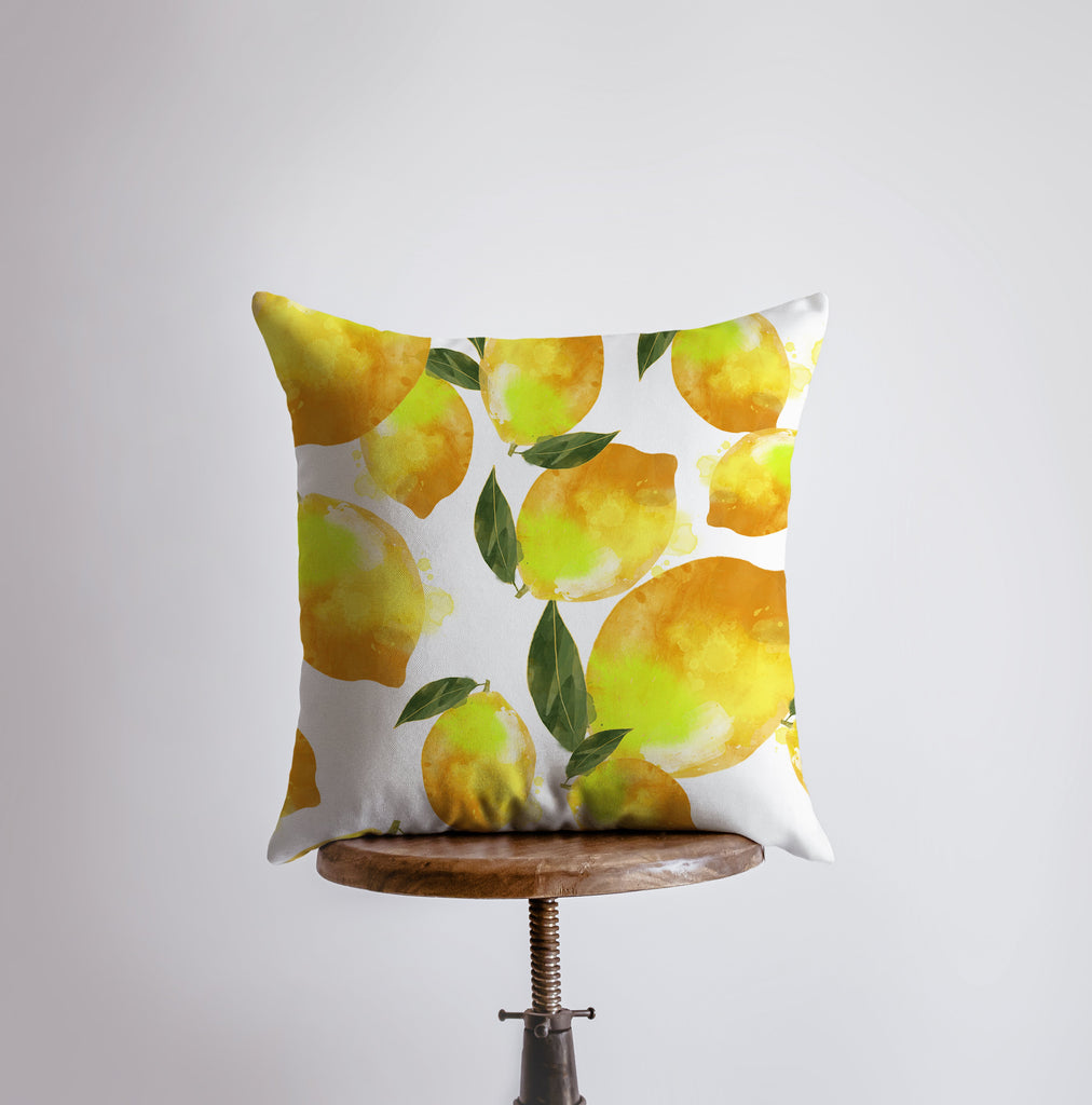 a pillow with a yellow lemon pattern on it