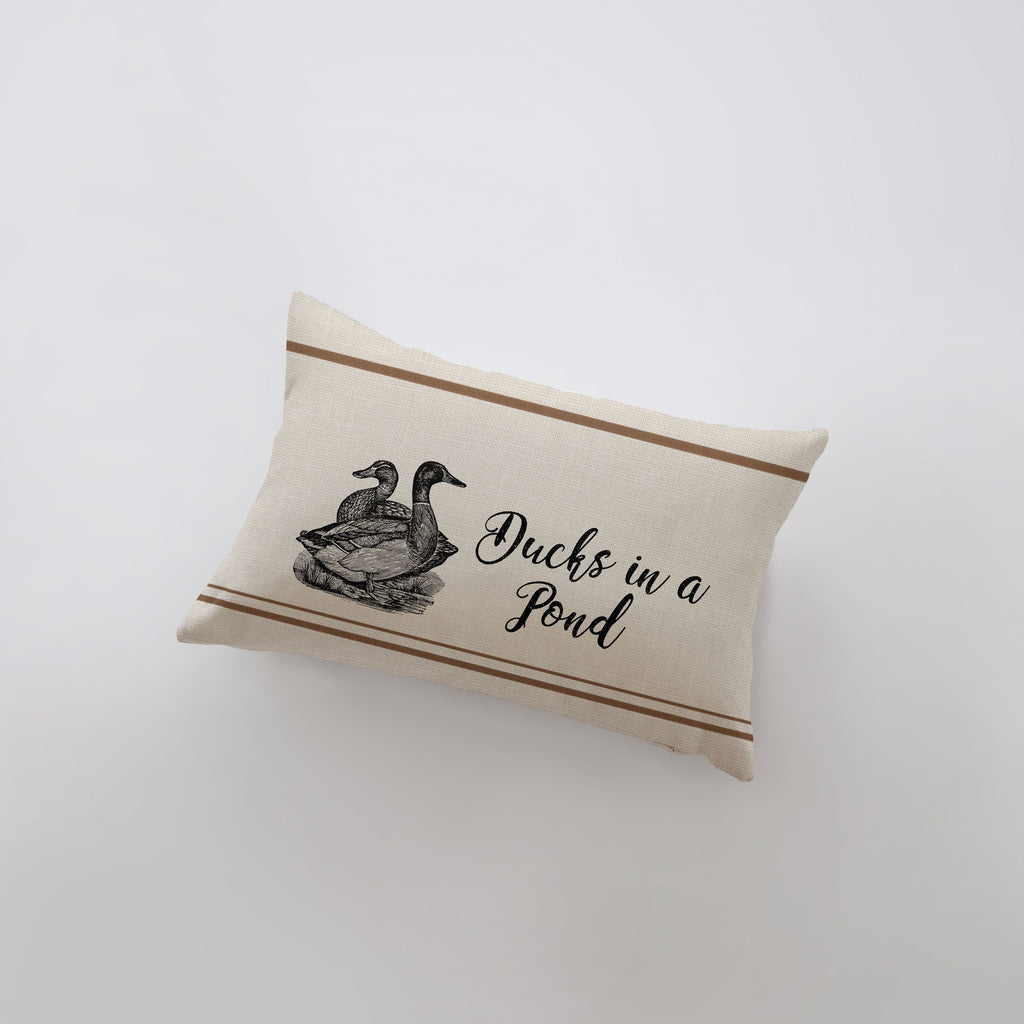 a pillow with a duck on it that says ducks in a pond