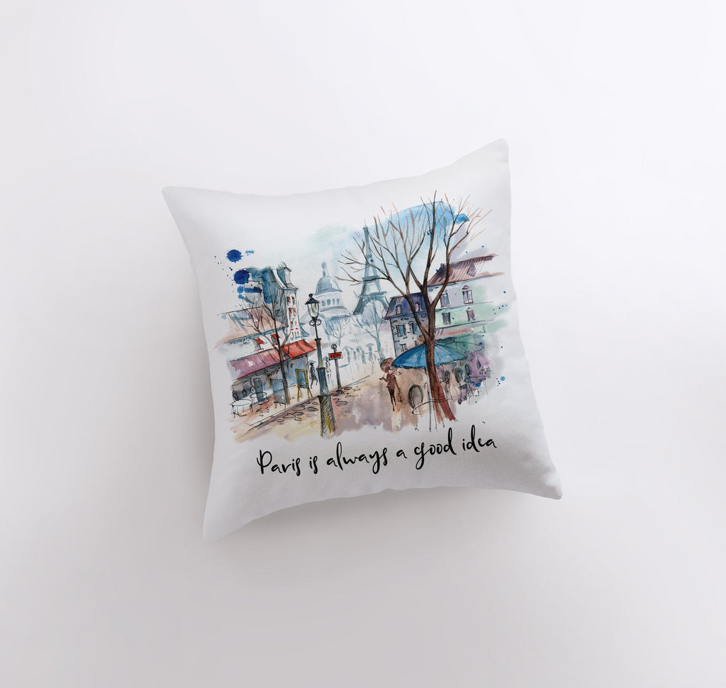 a pillow that has a picture of a town on it