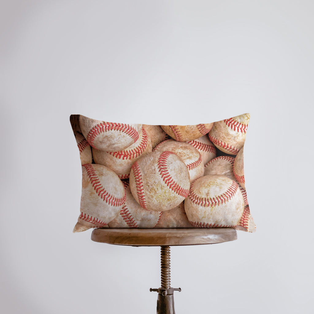 a pillow that has a baseball pattern on it