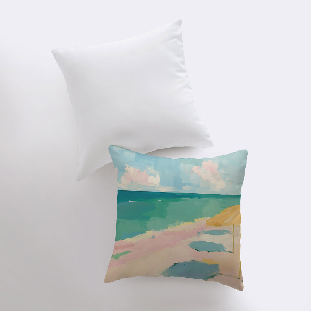 a pillow with a painting of a beach