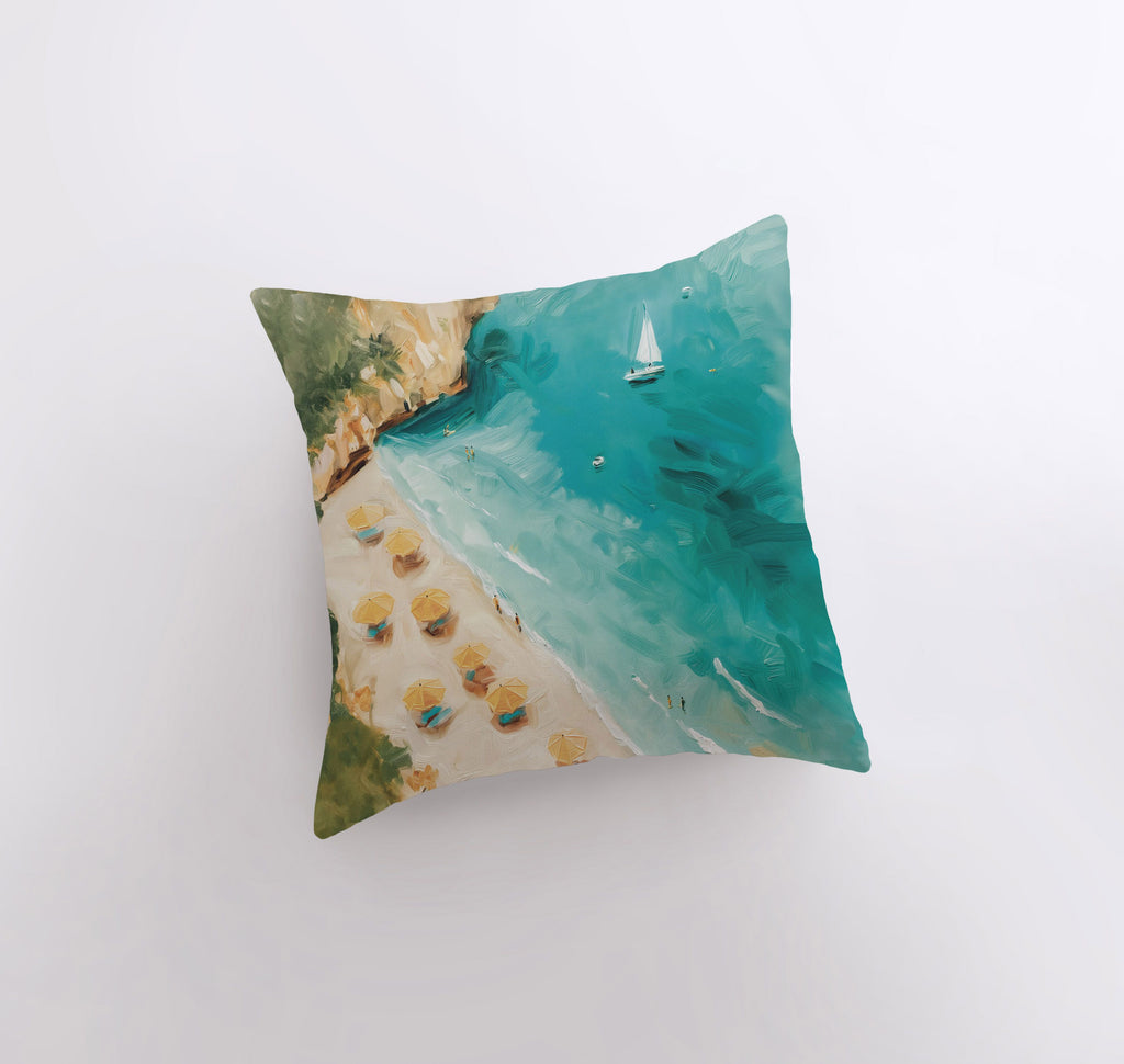 a pillow with a painting of a sailboat on a beach