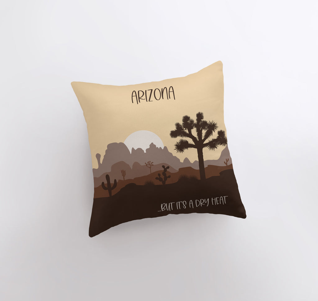 a pillow with a desert scene on it