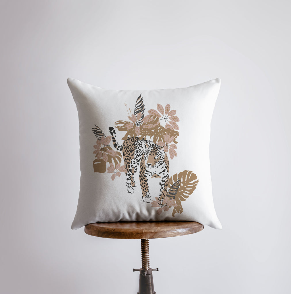 a white pillow with a picture of a leopard on it