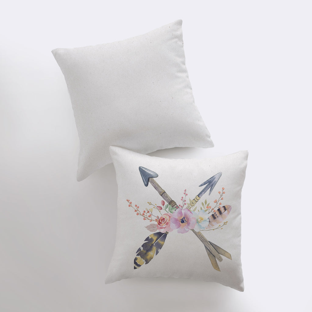 two pillows with arrows and flowers on them