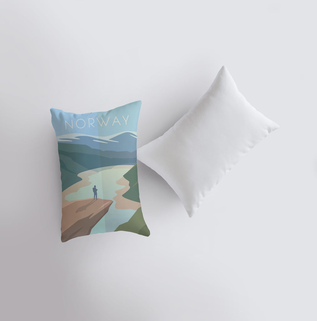 a pillow with a picture of a person standing on a beach