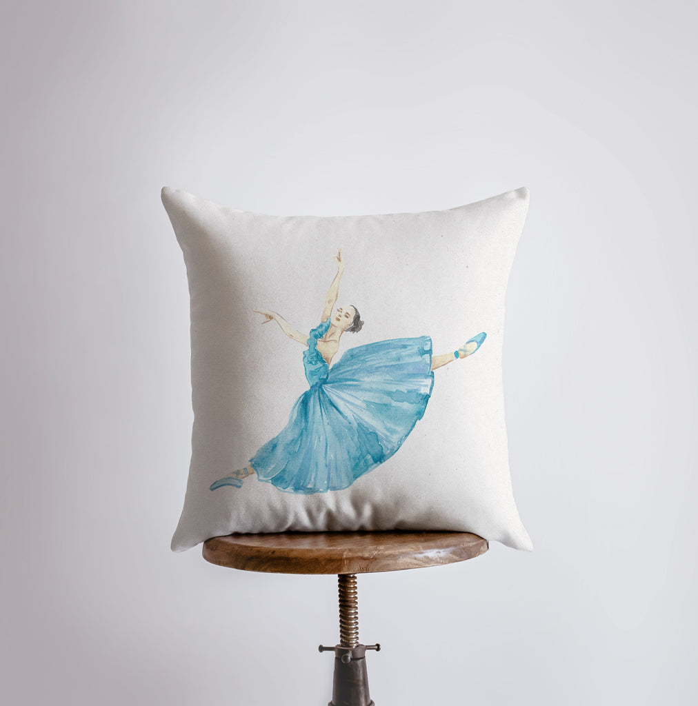 a pillow with a picture of a ballerina on it