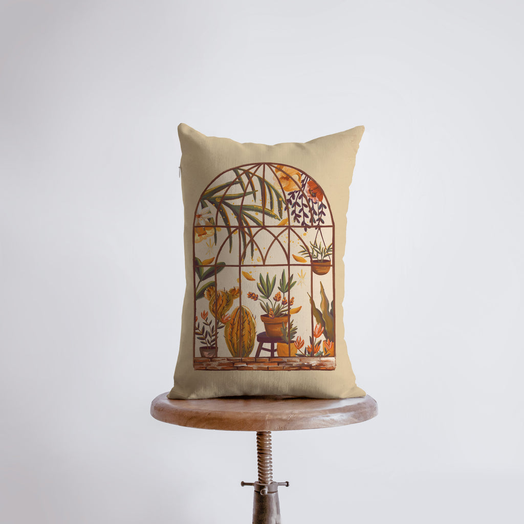 a pillow with a picture of a bird cage on it