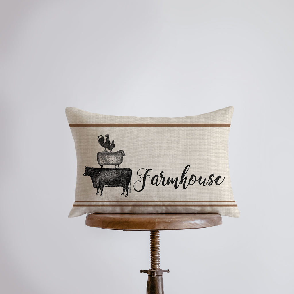 a pillow with a farm house design on it