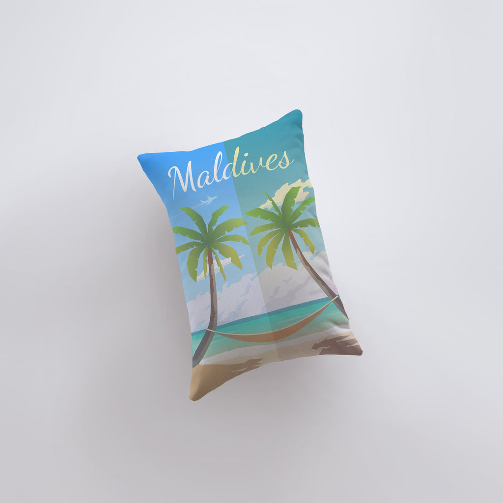 a pillow that has a picture of a palm tree on it