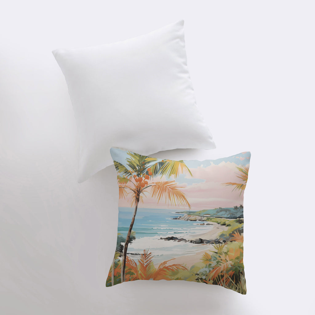 a pillow with a painting of a beach and palm trees